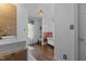 Charming bathroom featuring a clawfoot tub, stylish fixtures, and bright natural light at 116 W Front St, Oxford, NC 27565