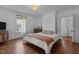Bright bedroom with wood floors, natural light and a comfortable bed at 116 W Front St, Oxford, NC 27565