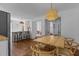 Open concept dining room featuring a wood table, chairs, a chandelier, and hardwood floors at 116 W Front St, Oxford, NC 27565