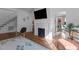Comfortable living area with decorative fireplace, hardwood flooring, and easy access to other rooms at 116 W Front St, Oxford, NC 27565