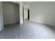Neutral bedroom featuring a closet, base trim, and a view into the hallway at 12 Gates St, Roxboro, NC 27573