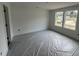 Bright bedroom with two large windows and neutral walls providing ample natural light at 12 Gates St, Roxboro, NC 27573