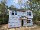 New construction shows the front of the home before siding and paint at 12 Gates St, Roxboro, NC 27573