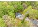 Overhead angle of home surrounded by verdant trees and foliage for a private, woodsy feel at 120 Kerigon Ln, Youngsville, NC 27596