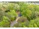 Scenic aerial view of a charming home nestled among lush green trees at 120 Kerigon Ln, Youngsville, NC 27596
