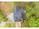 Aerial view of a cozy home, showcasing its well-maintained roof and surrounding greenery at 120 Kerigon Ln, Youngsville, NC 27596