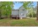 Backyard with deck; ample natural light showcases property at 120 Kerigon Ln, Youngsville, NC 27596