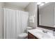 This bathroom features a shower/tub combo with a white shower curtain and a white single sink vanity at 120 Kerigon Ln, Youngsville, NC 27596