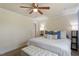 Bright and spacious bedroom with a ceiling fan and bench at the foot of the bed at 120 Kerigon Ln, Youngsville, NC 27596