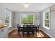 Dining area featuring hardwood floors, a chandelier, and windows for plenty of natural light at 120 Kerigon Ln, Youngsville, NC 27596