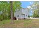 Exterior shot of the home with a deck, showing the property's landscape and serene surroundings at 120 Kerigon Ln, Youngsville, NC 27596