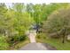 A home on a verdant lot and long driveway offering a peaceful and private setting at 120 Kerigon Ln, Youngsville, NC 27596
