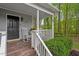 Inviting front porch with rocking chairs and lush greenery, offering a cozy welcome at 120 Kerigon Ln, Youngsville, NC 27596