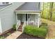 Front porch with seating, landscaping and clear house numbers at 120 Kerigon Ln, Youngsville, NC 27596