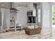 Kitchen island featuring granite countertops, stainless steel appliances, and stylish decor at 120 Kerigon Ln, Youngsville, NC 27596