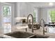 Close up of the kitchen island featuring a double sink and modern faucets at 120 Kerigon Ln, Youngsville, NC 27596