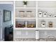 Kitchen with built-in shelving, granite countertops, and storage baskets at 120 Kerigon Ln, Youngsville, NC 27596