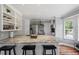 Open-concept kitchen features a large island with seating, granite countertops, and stainless steel appliances at 120 Kerigon Ln, Youngsville, NC 27596