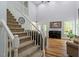 Spacious living room with hardwood floors, staircase, and lots of natural light at 120 Kerigon Ln, Youngsville, NC 27596