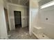 Unfinished bathroom with a walk-in shower, ready for personalized finishes and design at 125 Tee Dr, Selma, NC 27576