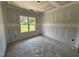 Unfinished bedroom with a bright window offering a view, perfect for customization and comfort at 125 Tee Dr, Selma, NC 27576