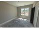 Bedroom with natural light, with beige walls and a closet at 125 Tee Dr, Selma, NC 27576