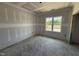 Unfinished bedroom with a bright window offering a view, perfect for customization and comfort at 125 Tee Dr, Selma, NC 27576