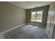 Bedroom featuring a window to provide natural light and outdoor views at 125 Tee Dr, Selma, NC 27576