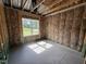An empty bedroom during construction with a single window at 125 Tee Dr, Selma, NC 27576