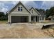 Charming home featuring a two-car garage and pleasant curb appeal at 125 Tee Dr, Selma, NC 27576