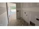 Unfinished laundry room with visible electrical and plumbing hookups, offering a functional space at 125 Tee Dr, Selma, NC 27576