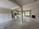 Open concept living room features a fireplace, modern wainscotting and outdoor access at 125 Tee Dr, Selma, NC 27576
