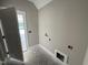 Mud room with outdoor access and connections for washer and dryer at 125 Tee Dr, Selma, NC 27576