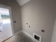 A mud room with painted walls, white trim and baseboards, and electrical outlets at 125 Tee Dr, Selma, NC 27576