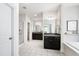 Modern primary bathroom with double sink vanities, shower, and soaking tub at 12833 Edsel Dr, Raleigh, NC 27613