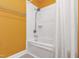 Clean bathroom with a white tiled shower and tub combination at 12833 Edsel Dr, Raleigh, NC 27613