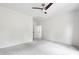 Neutral bedroom with carpet floors, ceiling fan and walk-in closet provides a cozy retreat at 12833 Edsel Dr, Raleigh, NC 27613