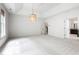 Spacious primary bedroom with tray ceilings and large window for lots of natural light at 12833 Edsel Dr, Raleigh, NC 27613