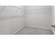 Walk-in closet with wire shelving and neutral carpet at 12833 Edsel Dr, Raleigh, NC 27613