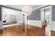 Elegant dining room with hardwood floors and stylish lighting perfect for gatherings and entertaining at 12833 Edsel Dr, Raleigh, NC 27613