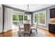 Dining area leads to a deck with outdoor seating offering serene views and easy outdoor access at 12833 Edsel Dr, Raleigh, NC 27613