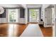 Inviting foyer with hardwood floors, wainscoting, a stylish light fixture, and a view of the front yard at 12833 Edsel Dr, Raleigh, NC 27613