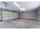 Bright garage with an automatic door and ample space for parking and storage at 12833 Edsel Dr, Raleigh, NC 27613