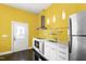 The updated kitchen area includes stainless steel appliances and a bright, contemporary style at 12833 Edsel Dr, Raleigh, NC 27613