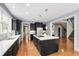 Kitchen with black cabinets, white countertops, and stainless steel appliances at 12833 Edsel Dr, Raleigh, NC 27613