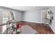 Spacious room featuring dark wood flooring, neutral walls and utility sink at 12833 Edsel Dr, Raleigh, NC 27613