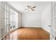 Bright office space with hardwood floors, crown molding, and ample natural light from French doors at 12833 Edsel Dr, Raleigh, NC 27613