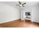 Office space with ceiling fan, hardwood flooring, and direct access to other rooms in the home at 12833 Edsel Dr, Raleigh, NC 27613