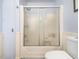 Bathroom featuring a large shower, toilet, and painted wood paneling along the walls at 1301 Lynnwood Rd, Knightdale, NC 27545