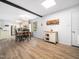 Bright dining area adjacent to the kitchen, featuring a wooden table with black chairs at 1301 Lynnwood Rd, Knightdale, NC 27545